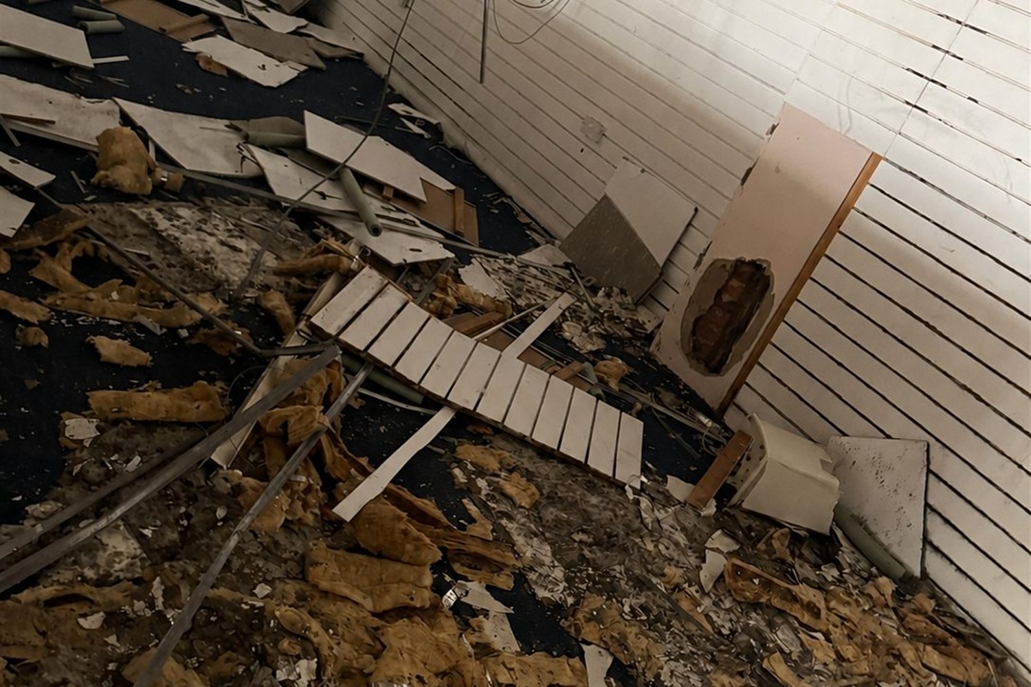 Collapsed ceiling panels and insulation